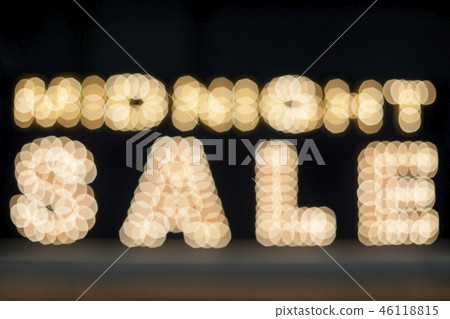 Midnight sale background. Brightly colored vintage advertising sign board with illumination 46118815
