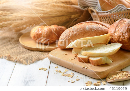 bread sliced and croissant on wood 46119059