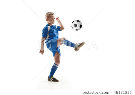 Young boy with soccer ball doing flying kick 46121835