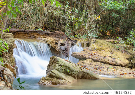 Waterfall flowing from the mountains . Waterfall flowing from the mountains . 46124582