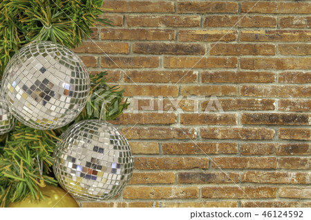 Glass ball ornaments on a Christmas tree. 46124592
