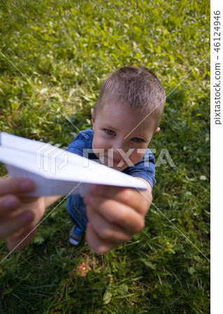 Boy 4 years old, under the green grass in summer Boy 4 years old, under the green grass in summer 46124946