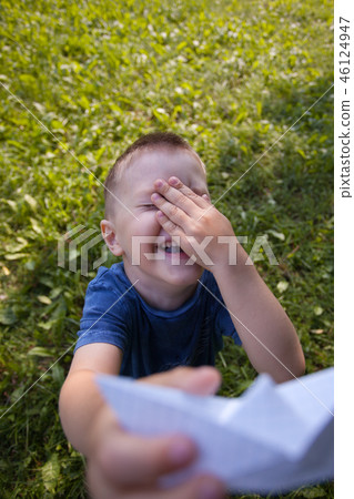Boy 4 years old, under the green grass in summer Boy 4 years old, under the green grass in summer 46124947
