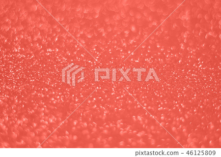 Blurred glitter background living coral color. Blurred glitter background living coral color. 46125809