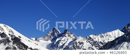 Panoramic view on snowy mountain peaks in winter Panoramic view on snowy mountain peaks in winter 46126805