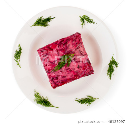Salad herring under fur coat on a white plate is 46127097