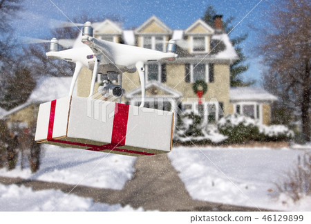 Unmanned Aircraft System Drone Delivering a Gift 46129899