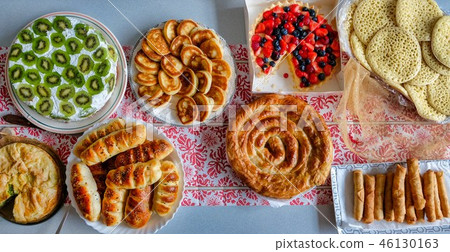 Delicious food and pies on a table Delicious food and pies on a table 46130163
