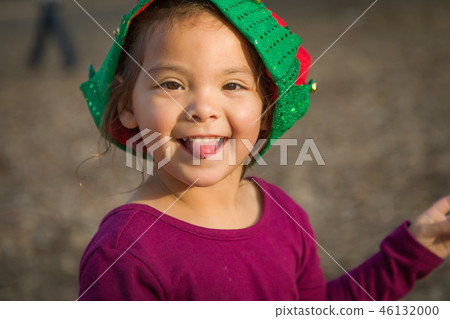 Mixed Race Toddler Girl Wearing a Christmas Hat Mixed Race Toddler Girl Wearing a Christmas Hat 46132000