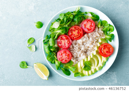 Oatmeal porridge with vegetable salad 46136752