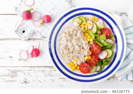 Oatmeal porridge with vegetable salad Oatmeal porridge with vegetable salad 46136775