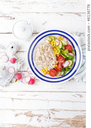 Oatmeal porridge with vegetable salad 46136776