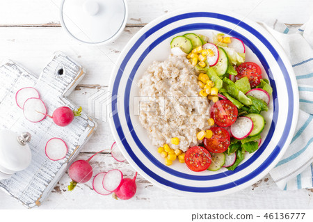 Oatmeal porridge with vegetable salad Oatmeal porridge with vegetable salad 46136777