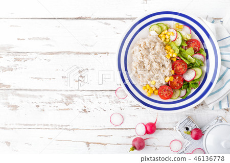Oatmeal porridge with vegetable salad Oatmeal porridge with vegetable salad 46136778