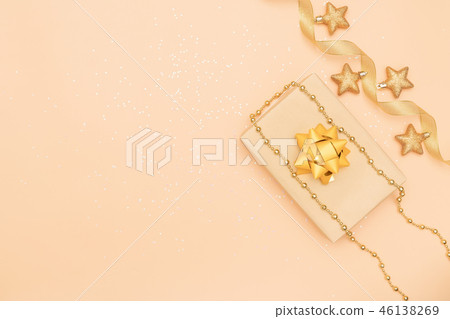 gifts box with golden bows and star on golden 46138269