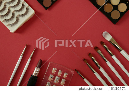 top view of women’s cosmetic on red background top view of women’s cosmetic on red background 46139371