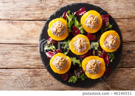 Delicious appetizer peaches stuffed with tuna Delicious appetizer peaches stuffed with tuna 46140551