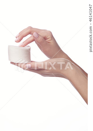 Woman hand and nail varnish remover Woman hand and nail varnish remover 46141047