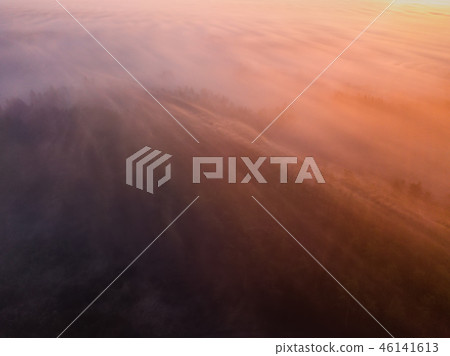 Beautiful misty dawn. Flying above the clouds, drone video 46141613