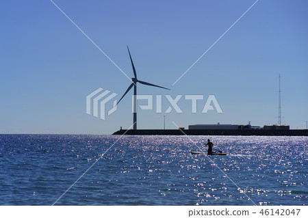 Atlantic ocean shore at the sunset. Wind turbines 46142047