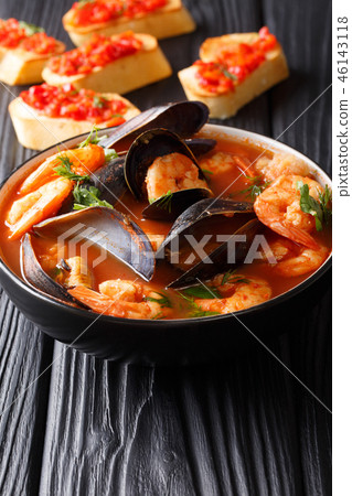 Traditional tomato seafood soup 46143118