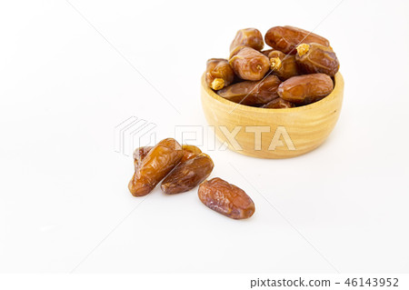 Bowl of dried dates on white Bowl of dried dates on white 46143952