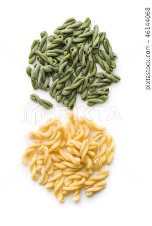 Uncooked spinach gemelli pasta. 46144068