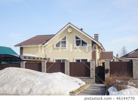 Small cottage in spring time 46144770