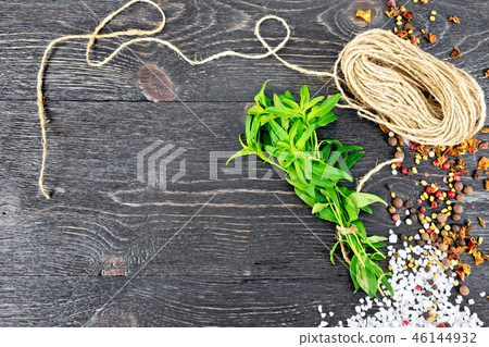 Savory leaves with twine on black board 46144932