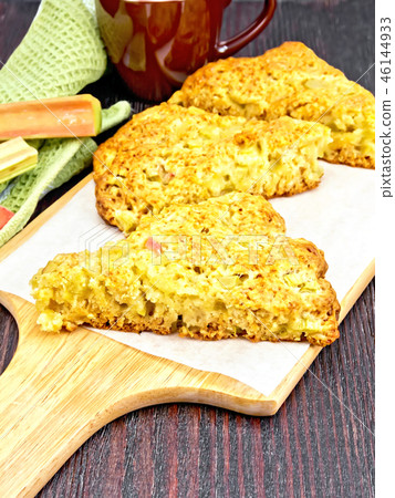 Scones with rhubarb on wooden board Scones with rhubarb on wooden board 46144933