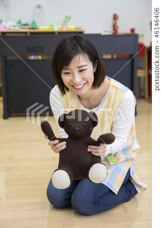 Mr. Hobo playing with a toy and a bear plush Mr. Hobo playing with a toy and a bear plush 46146406