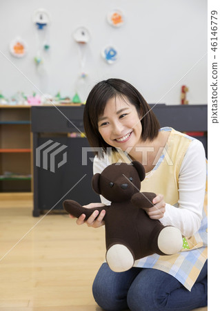 Mr. Hobo playing with a toy and a bear plush 46146779