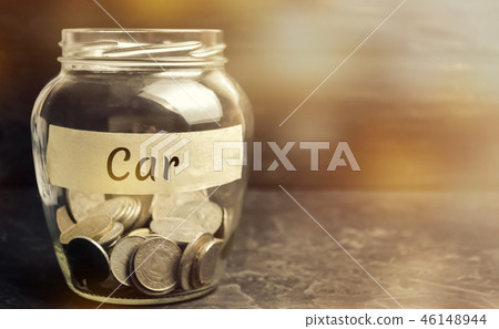 Glass jar with coins and the inscription "Car". 46148944