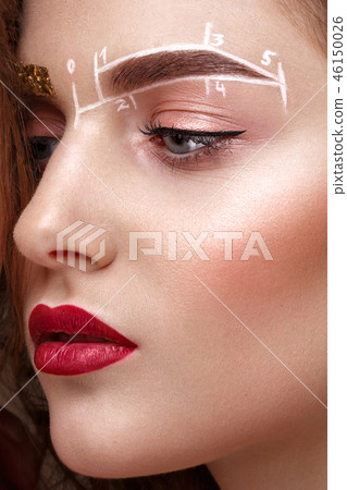 girl with an unusual eyebrow makeup. Beauty face. girl with an unusual eyebrow makeup. Beauty face. 46150026