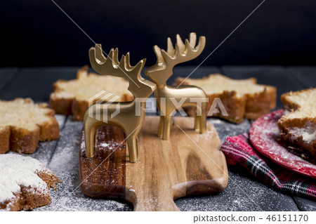 Italian Christmas cupcake with powdered sugar. Traditional festive pastries and deer for decor. Free Italian Christmas cupcake with powdered sugar. Traditional festive pastries and deer for decor. Free 46151170