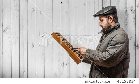 Concept: financial auditor with old wooden abacus Concept: financial auditor with old wooden abacus 46152834