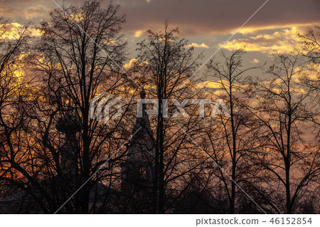 Silhouette of a church on a background of trees at sunrise. 46152854