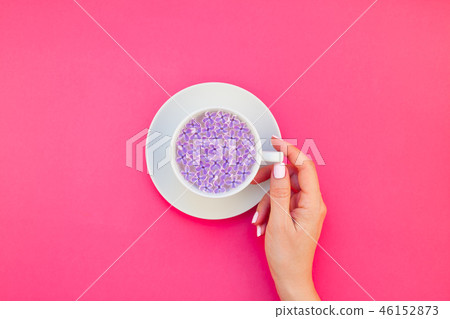 Cup of beautiful lilac flowers infused water Cup of beautiful lilac flowers infused water 46152873