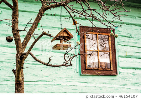 Bird house with feed on tree in Vlkolinec Slovakia Bird house with feed on tree in Vlkolinec Slovakia 46154107