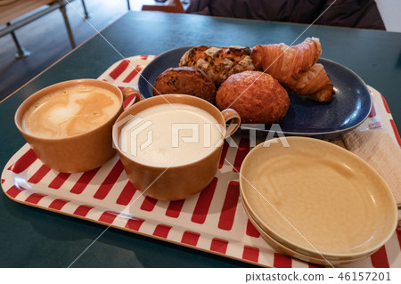 Hot milk, latte and bread 46157201
