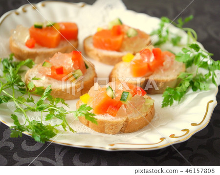 Baguette canape with salmon and conso méjezé black background (horizontal position) Baguette canape with salmon and conso méjezé black background (horizontal position) 46157808
