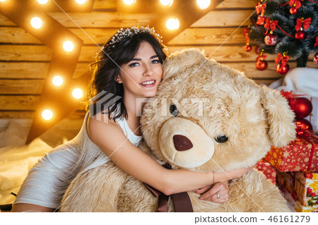 beautiful young woman near Christmas tree 46161279