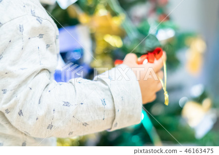 Christmas image Children decorating a Christmas tree Christmas image Children decorating a Christmas tree 46163475