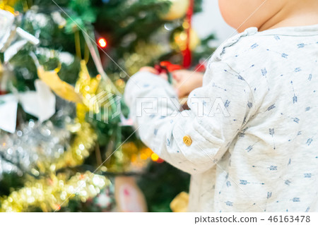 Christmas image Children decorating a Christmas tree 46163478