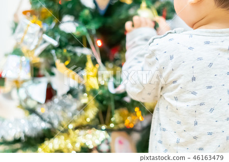 Christmas image Children decorating a Christmas tree 46163479