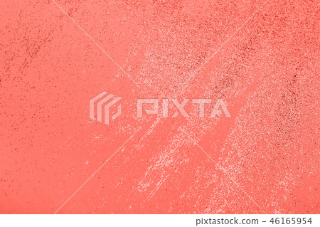 Festive pastel coral background with metallic confetti. 46165954