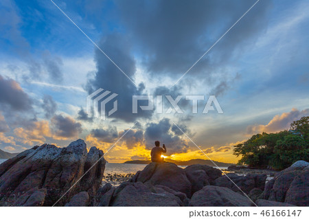 a man selfie on the rock at sunrise a man selfie on the rock at sunrise 46166147