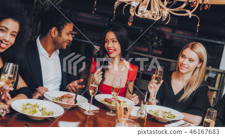 Friends Chilling Out Enjoying Meal in Restaurant Friends Chilling Out Enjoying Meal in Restaurant 46167683