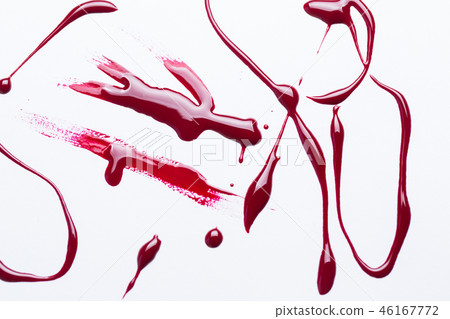 Nail polish on a white background in the form of strips and drops Nail polish on a white background in the form of strips and drops 46167772