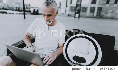 Man is Using a Laptop Computer 46171302
